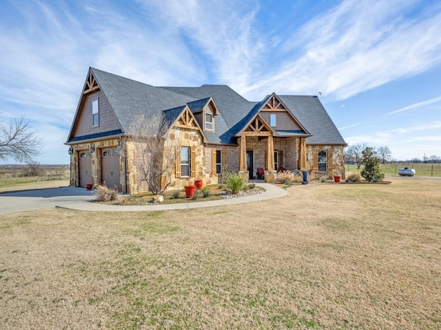 craftsman-style home featuring a garage and a front lawn