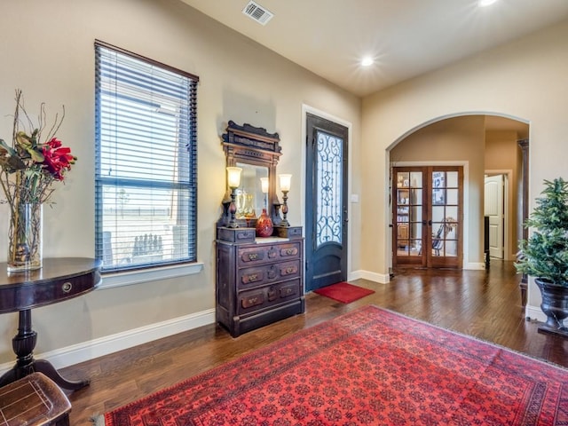 foyer entrance featuring dark wood-type flooring and french doors