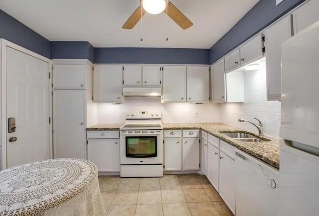 kitchen featuring sink, white appliances, tasteful backsplash, white cabinets, and light tile patterned flooring