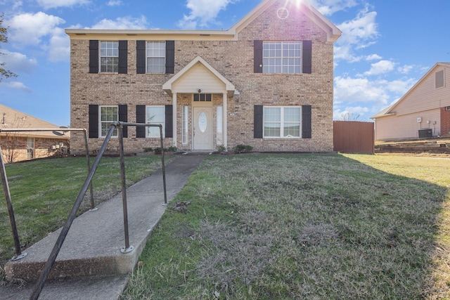 view of front facade featuring central AC and a front lawn