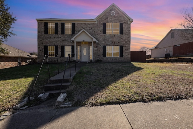 view of front of property with a lawn