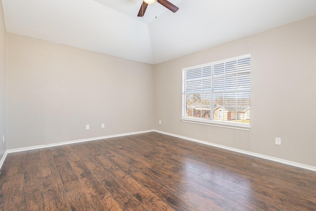 spare room featuring dark hardwood / wood-style flooring, lofted ceiling, and ceiling fan