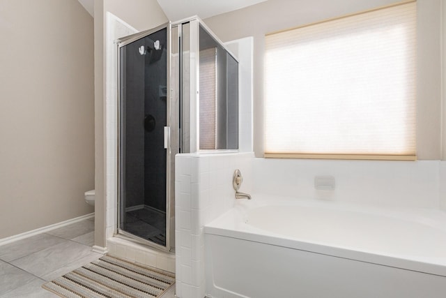 bathroom with separate shower and tub, tile patterned floors, and toilet