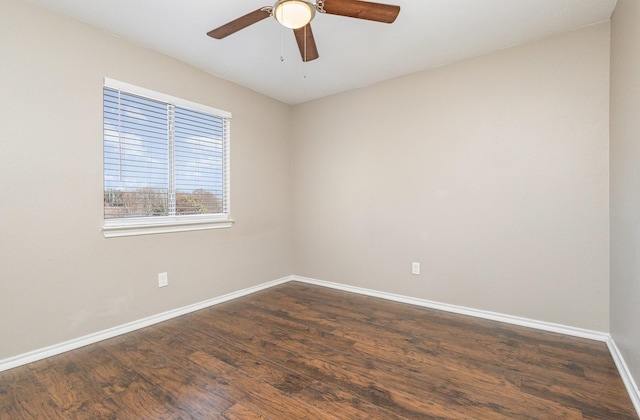 empty room featuring ceiling fan and dark hardwood / wood-style floors