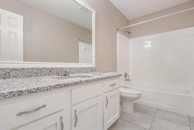 full bathroom with shower / tub combination, tile patterned floors, toilet, and vanity