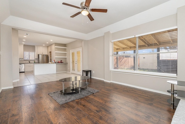 living room featuring hardwood / wood-style flooring and ceiling fan