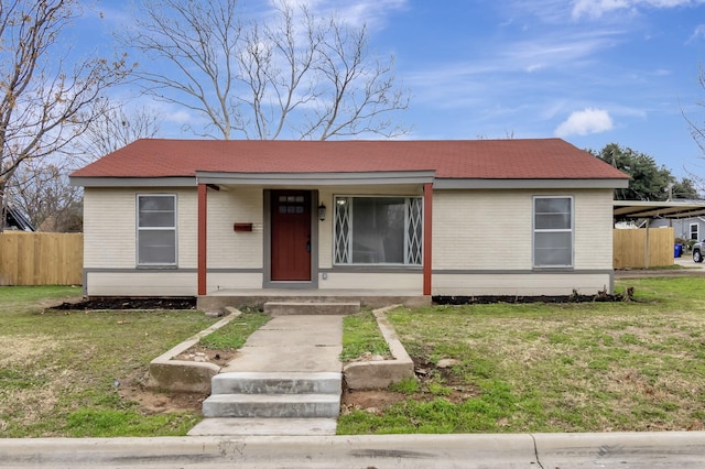 view of front of property with covered porch and a front yard