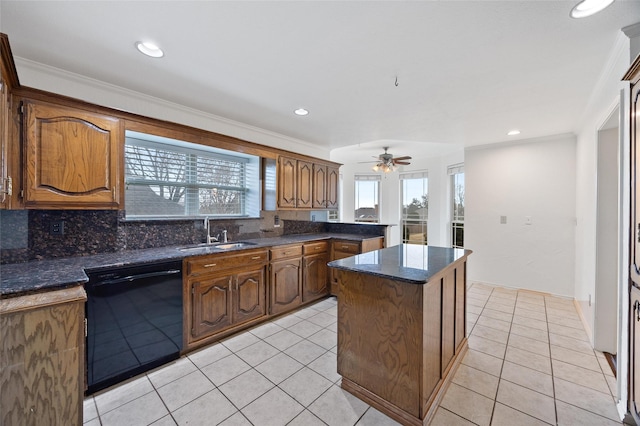 kitchen featuring sink, light tile patterned floors, dishwasher, a center island, and tasteful backsplash