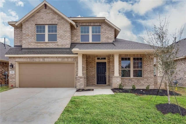 craftsman-style home with a garage and a front lawn