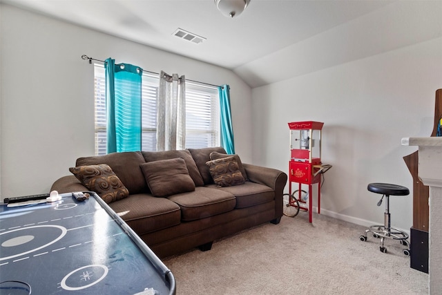 carpeted living room with vaulted ceiling