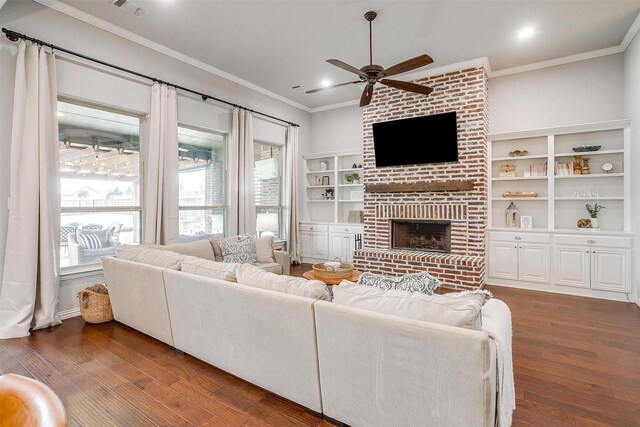 957 Prairie Timber Rd, Burleson, TX 76028 - living room featuring a brick fireplace, a ceiling fan, ornamental molding, and wood finished floors