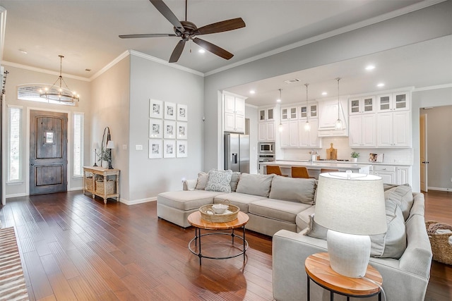 957 Prairie Timber Rd, Burleson, TX 76028 - living area featuring dark wood-style flooring, baseboards, recessed lighting, and ceiling fan with notable chandelier