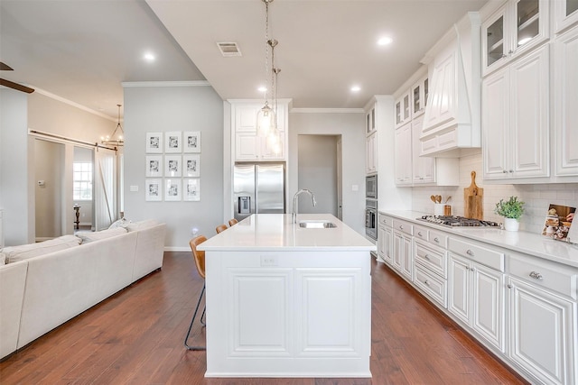 957 Prairie Timber Rd, Burleson, TX 76028 - kitchen featuring stainless steel appliances, open floor plan, ornamental molding, and a sink