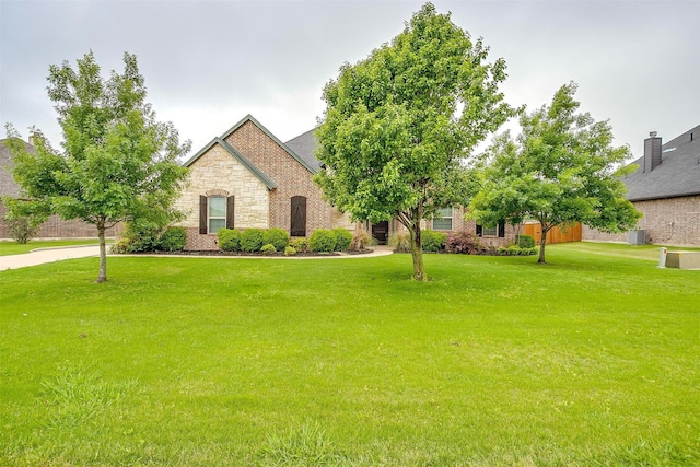 957 Prairie Timber Rd, Burleson, TX 76028 - view of front of property featuring a front lawn and stone siding