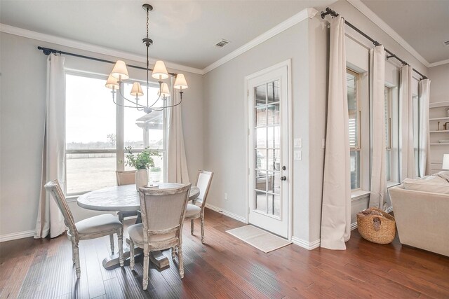 dining room featuring ornamental molding, ceiling fan with notable chandelier, dark wood-type flooring, and sink