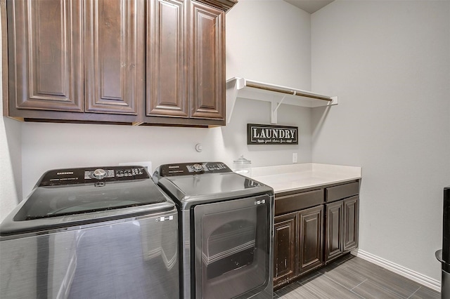 957 Prairie Timber Rd, Burleson, TX 76028 - laundry room with cabinet space, baseboards, and washer and clothes dryer