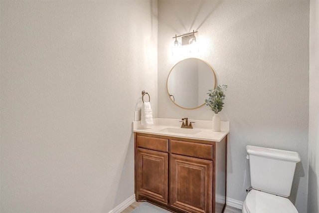 957 Prairie Timber Rd, Burleson, TX 76028 - bathroom featuring toilet, baseboards, and vanity