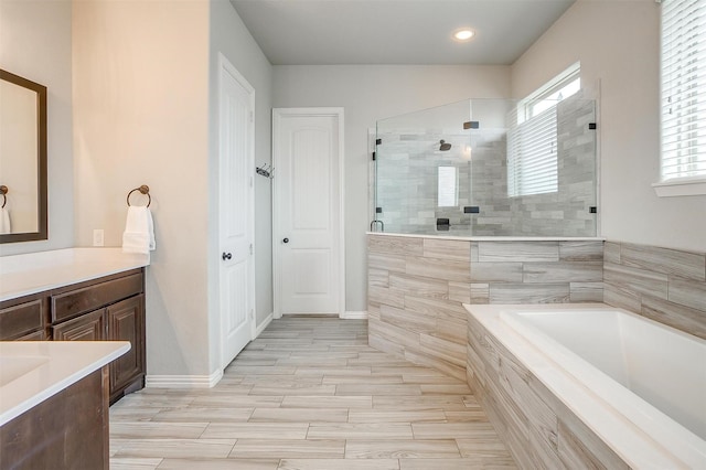 957 Prairie Timber Rd, Burleson, TX 76028 - full bath featuring vanity, wood finished floors, tiled shower, recessed lighting, and a bath