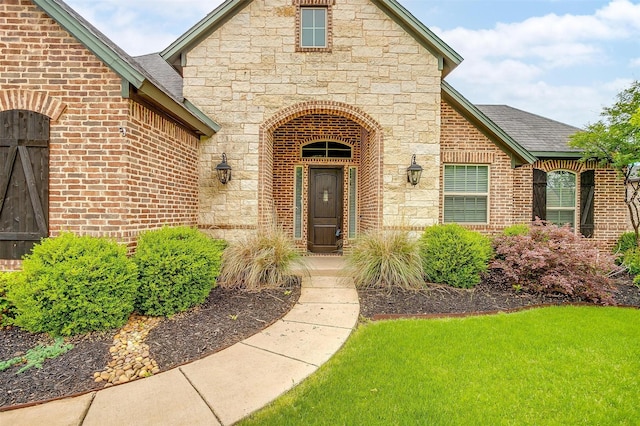 957 Prairie Timber Rd, Burleson, TX 76028 - entrance to property featuring brick siding, a shingled roof, a yard, and stone siding