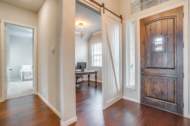 957 Prairie Timber Rd, Burleson, TX 76028 - entryway featuring baseboards, a barn door, and dark wood-style flooring