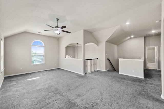 bonus room with vaulted ceiling, ceiling fan, and dark colored carpet