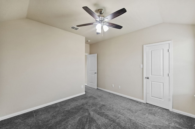 unfurnished room with dark colored carpet, lofted ceiling, and ceiling fan