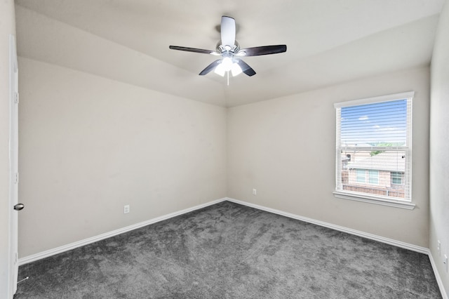 unfurnished room featuring ceiling fan and dark colored carpet