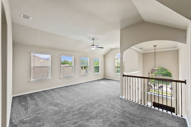 unfurnished room featuring lofted ceiling, ceiling fan, and dark colored carpet