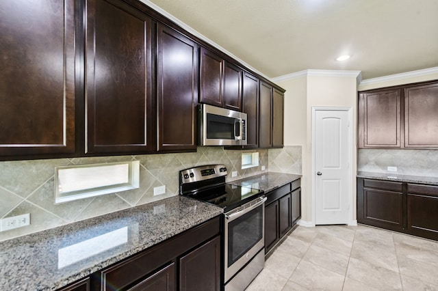 kitchen with dark brown cabinetry, light stone counters, tasteful backsplash, ornamental molding, and appliances with stainless steel finishes