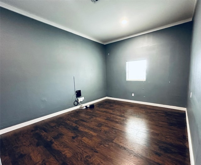 unfurnished room with wood finished floors and baseboards