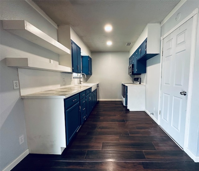 kitchen featuring open shelves, a sink, light countertops, blue cabinets, and range