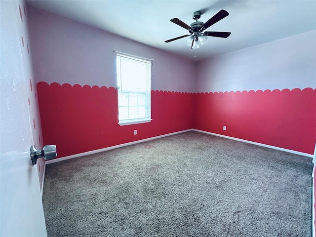 empty room with baseboards and a ceiling fan