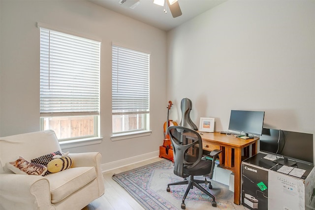 office with ceiling fan and light wood-type flooring