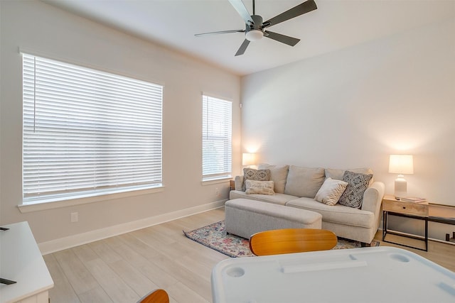 living room with hardwood / wood-style floors and ceiling fan