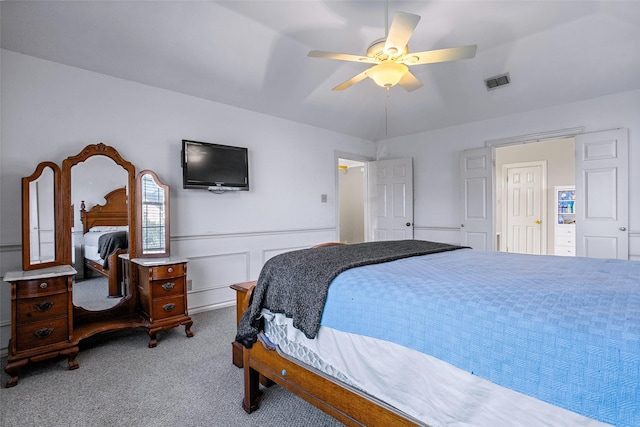 bedroom featuring light colored carpet and ceiling fan