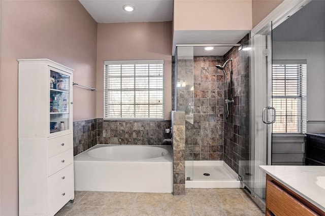 bathroom featuring vanity, tile patterned flooring, and independent shower and bath