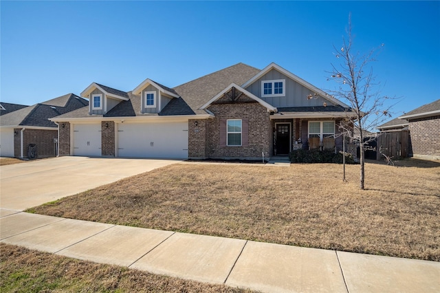 view of front of home with a garage and a front yard