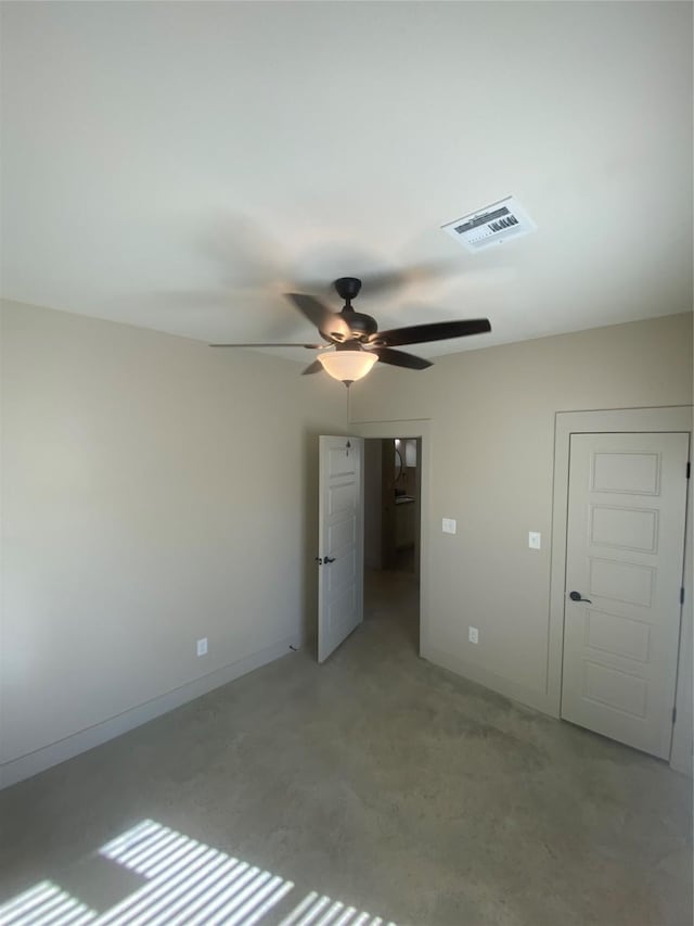 unfurnished bedroom featuring concrete floors and ceiling fan