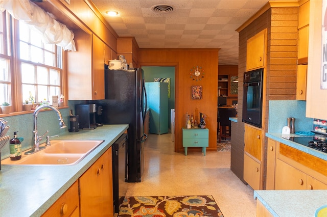 kitchen featuring sink and black appliances