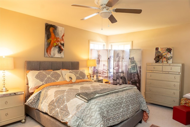 bedroom featuring ceiling fan and light colored carpet