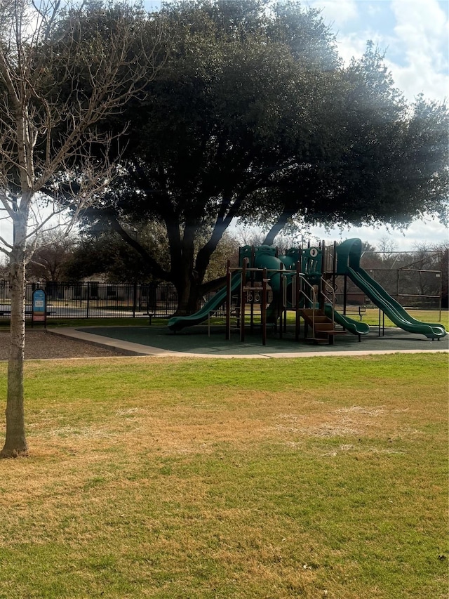 view of playground with a lawn