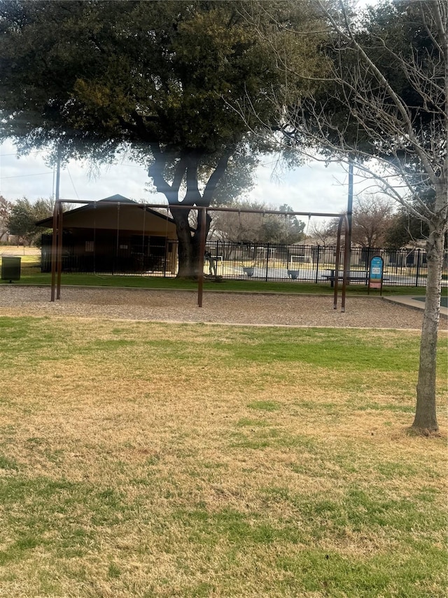 view of home's community with a yard