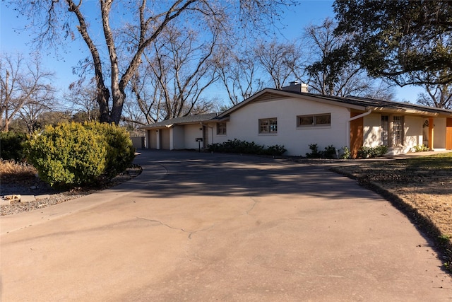 single story home with a garage