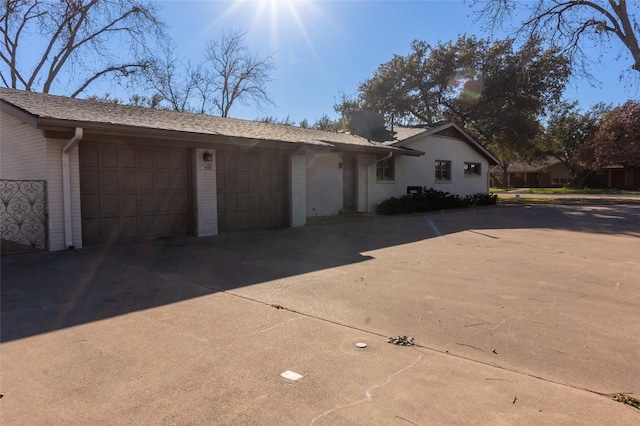 view of side of property with a garage