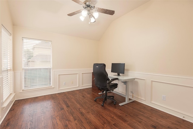 office space with lofted ceiling, ceiling fan, a wainscoted wall, wood finished floors, and a decorative wall