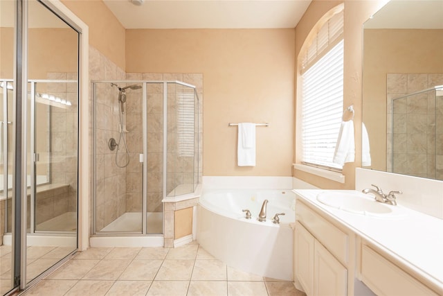 bathroom featuring tile patterned flooring, plus walk in shower, and vanity