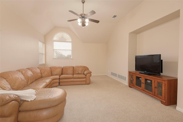 living room featuring vaulted ceiling, light carpet, and ceiling fan