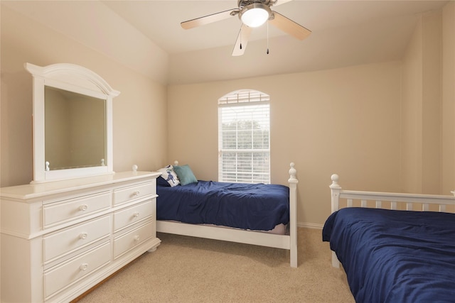 bedroom featuring light carpet, ceiling fan, and lofted ceiling
