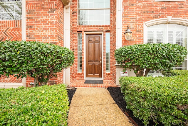 property entrance with brick siding