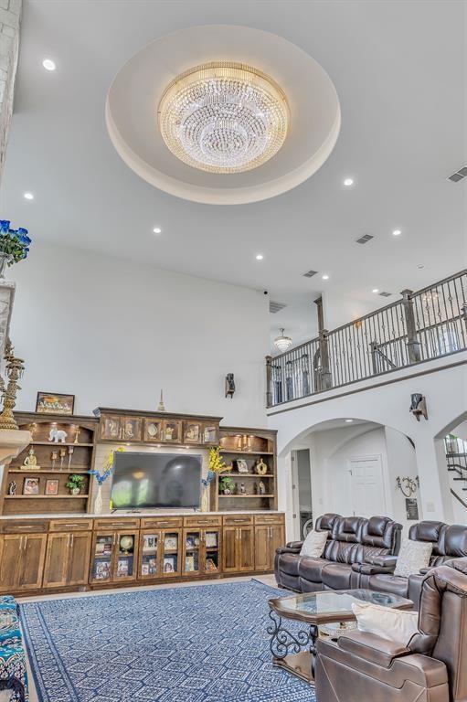 living room with a towering ceiling